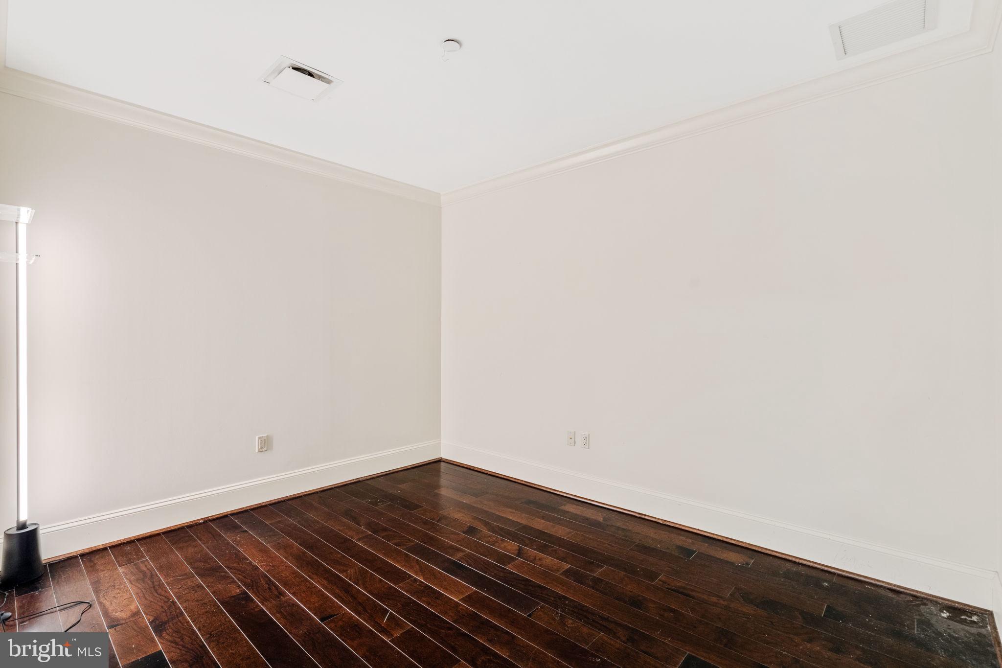 50 South 16th Street, Unit 4304 Philadelphia, PA 19103 - Photo 14 of 43 a view of room with wooden floor