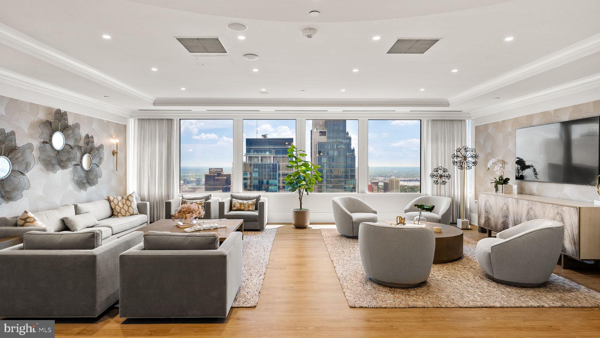 50 South 16th Street, Unit 4304 Philadelphia, PA 19103 - Photo 27 of 43 a living room with furniture and a large window