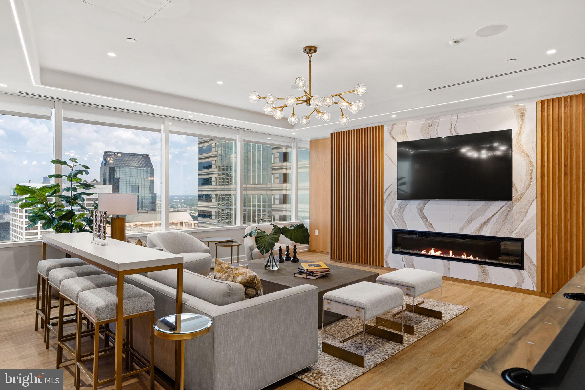 50 South 16th Street, Unit 4304 Philadelphia, PA 19103 - Photo 34 of 43 a living room with furniture and a flat screen tv