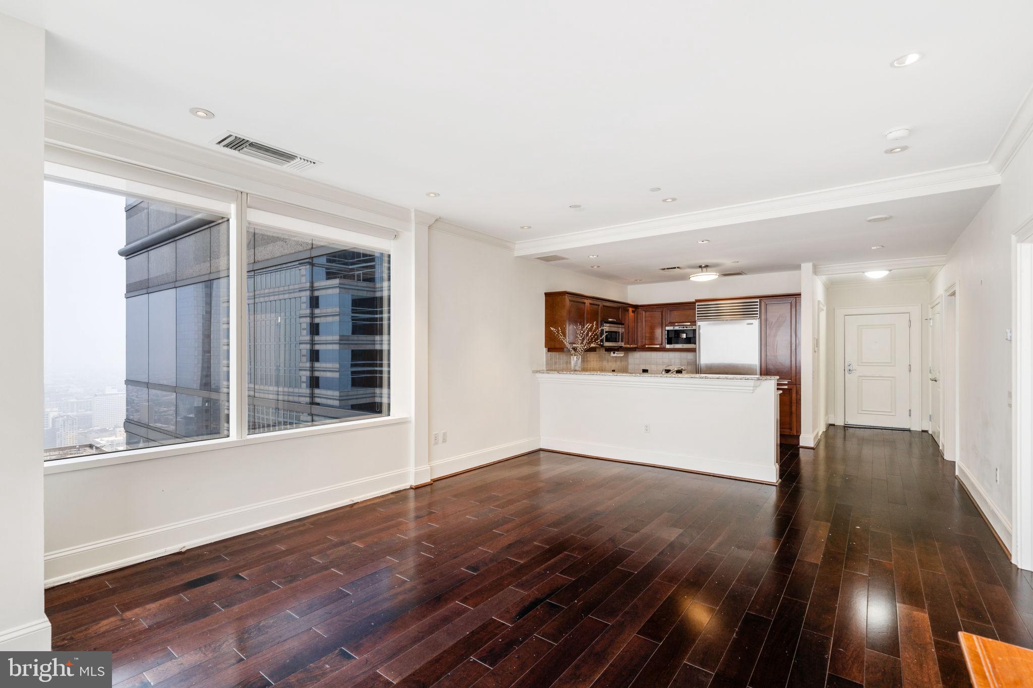 50 South 16th Street, Unit 4304 Philadelphia, PA 19103 - Photo 7 of 43 a view of a big room with wooden floor and windows