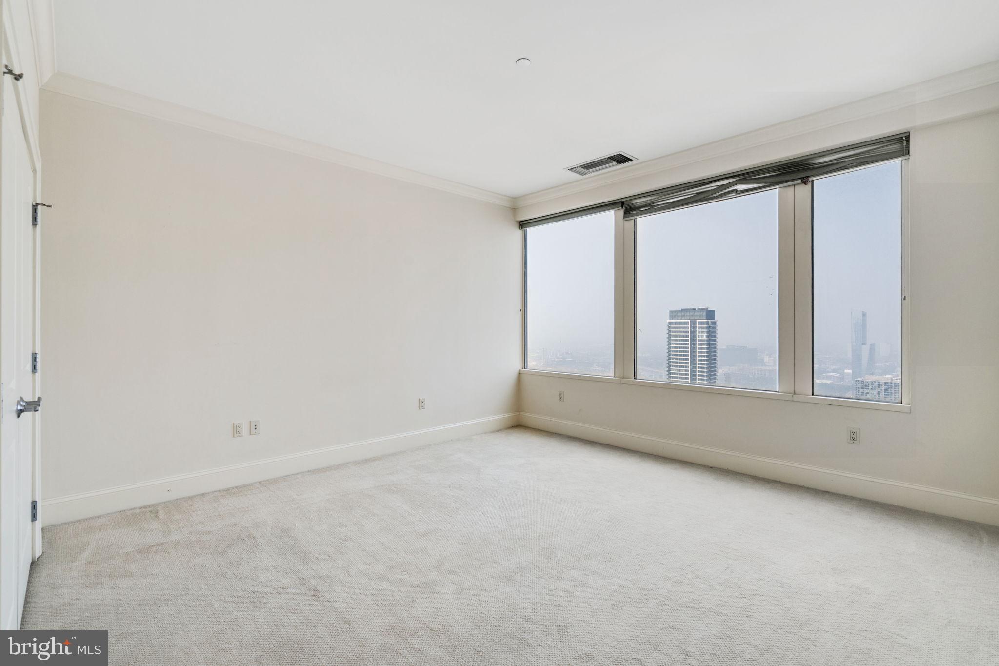 50 South 16th Street, Unit 4304 Philadelphia, PA 19103 - Photo 8 of 43 an empty room with window