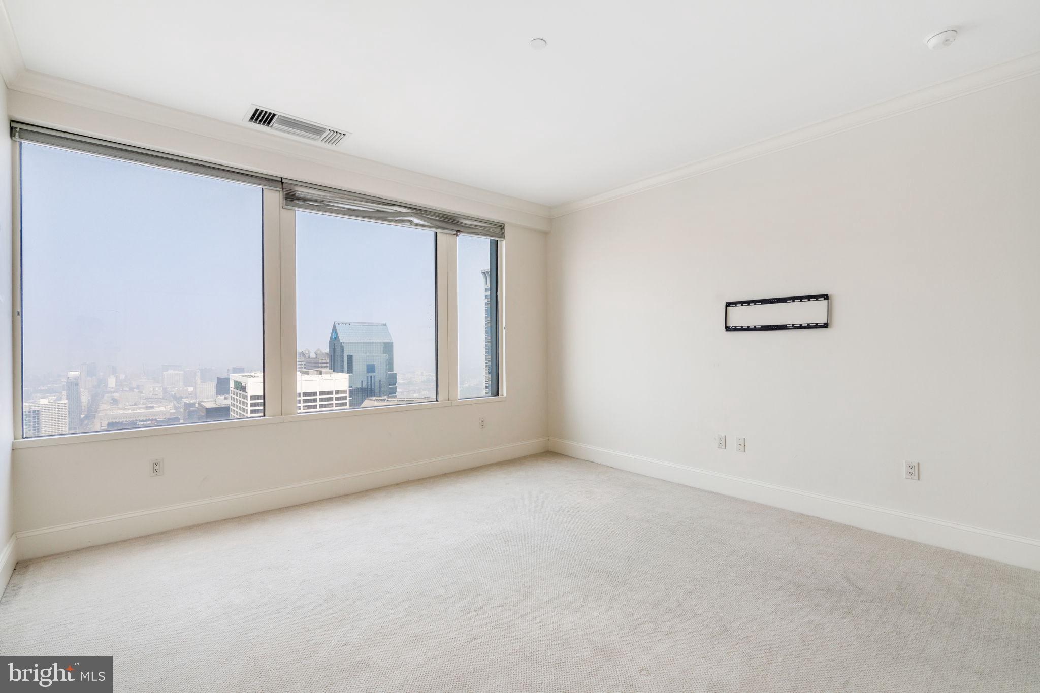 50 South 16th Street, Unit 4304 Philadelphia, PA 19103 - Photo 9 of 43 a view of an empty room with a window