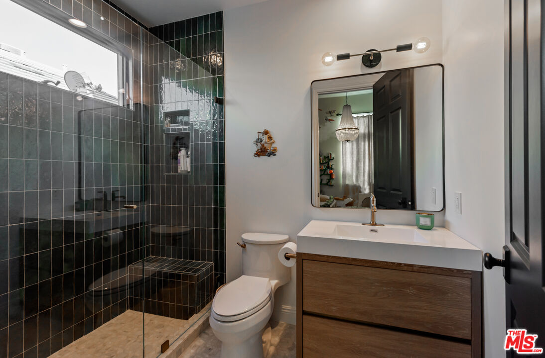 123 Channel Pointe Mall Marina del Rey, CA 90292 - Photo 35 of 75 a bathroom with a sink a toilet and shower