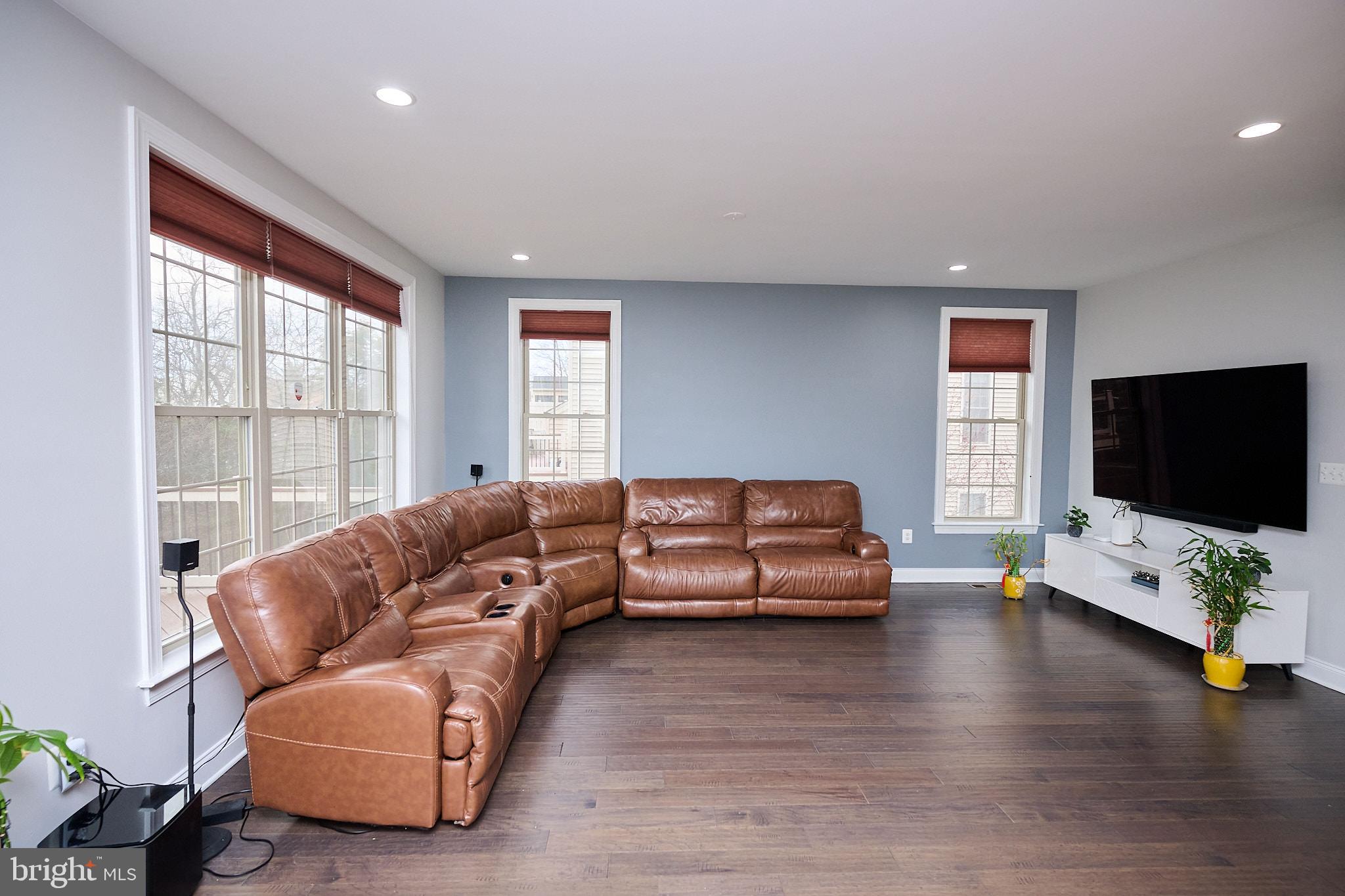 22559 Windsor Locks Square Ashburn, VA 20148 - Photo 14 of 35 a living room with furniture and a flat screen tv