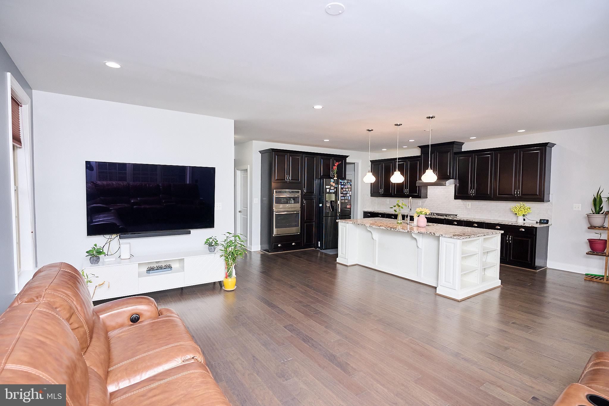 22559 Windsor Locks Square Ashburn, VA 20148 - Photo 15 of 35 a living room with furniture and a flat screen tv