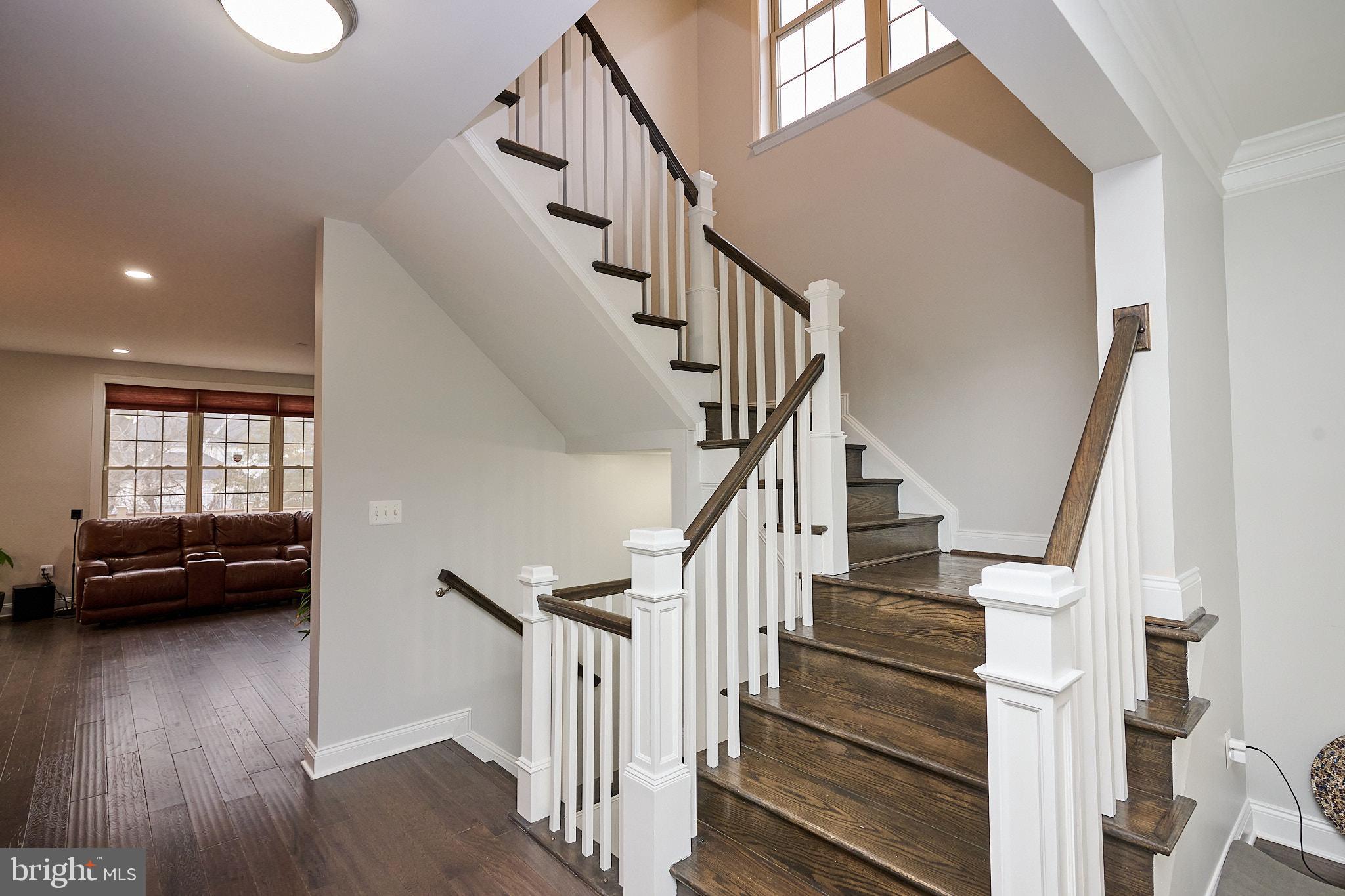 22559 Windsor Locks Square Ashburn, VA 20148 - Photo 20 of 35 a view of entryway and hall with wooden floor