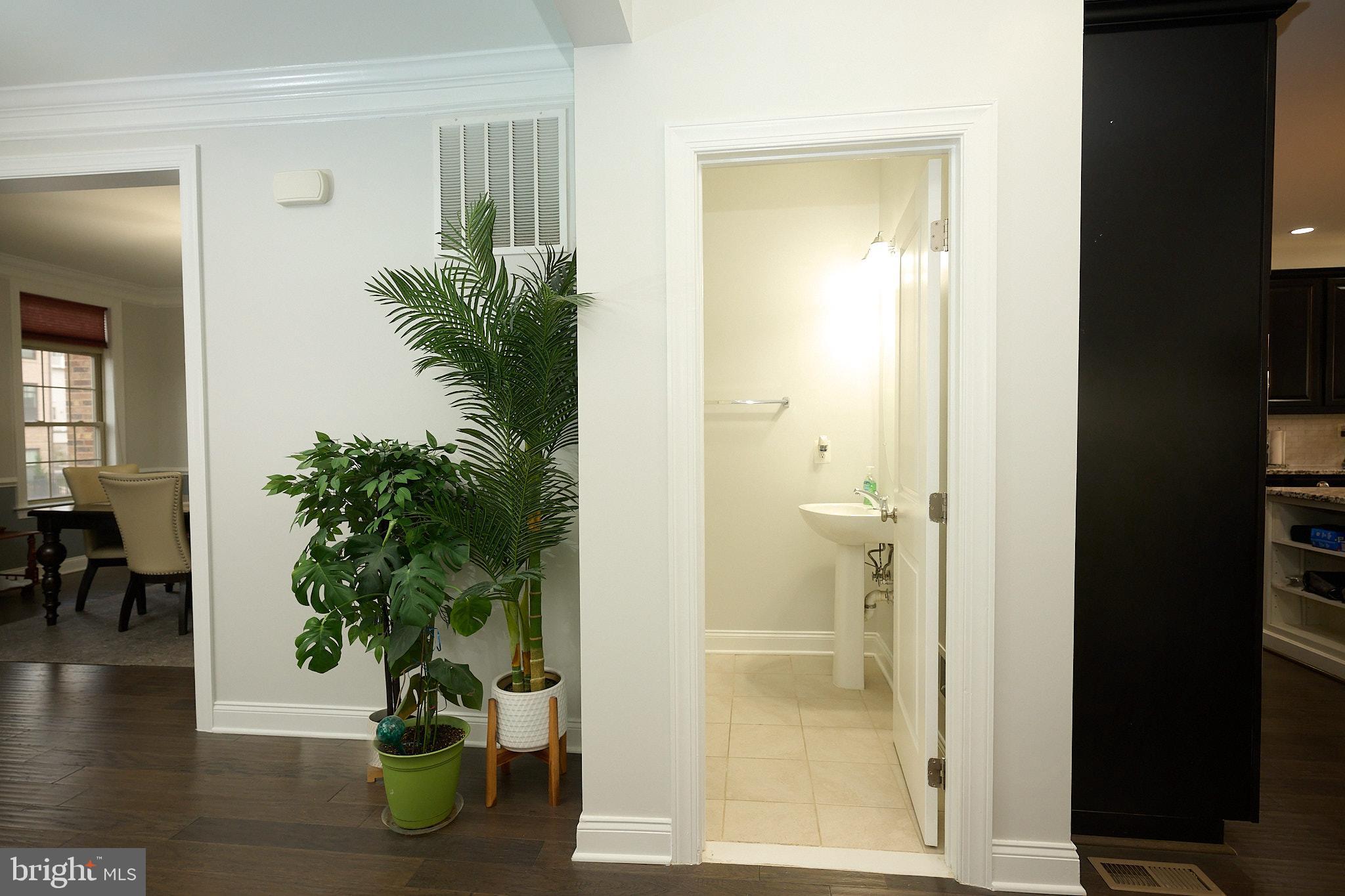 22559 Windsor Locks Square Ashburn, VA 20148 - Photo 22 of 35 wooden floor with a potted plant in front of a house