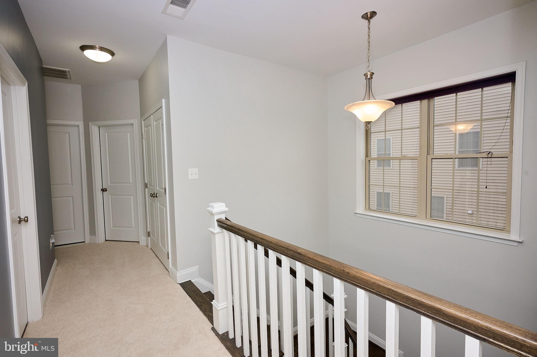 22559 Windsor Locks Square Ashburn, VA 20148 - Photo 24 of 35 a view of hallway with windows