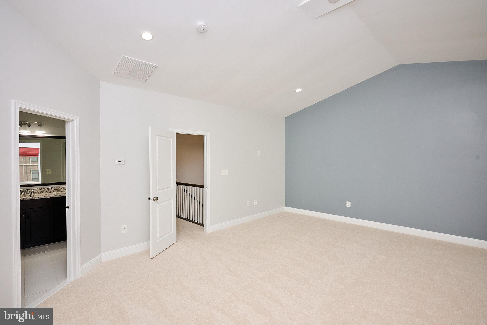 22559 Windsor Locks Square Ashburn, VA 20148 - Photo 27 of 35 an empty room with closet and wooden floor