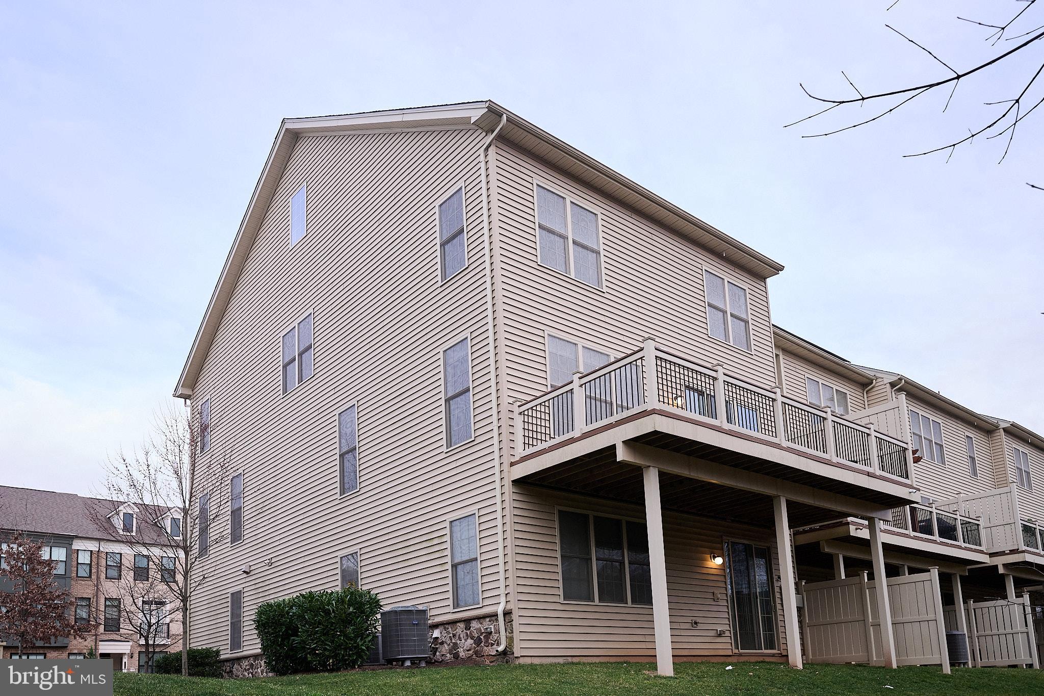 22559 Windsor Locks Square Ashburn, VA 20148 - Photo 34 of 35 a front view of a house with garage