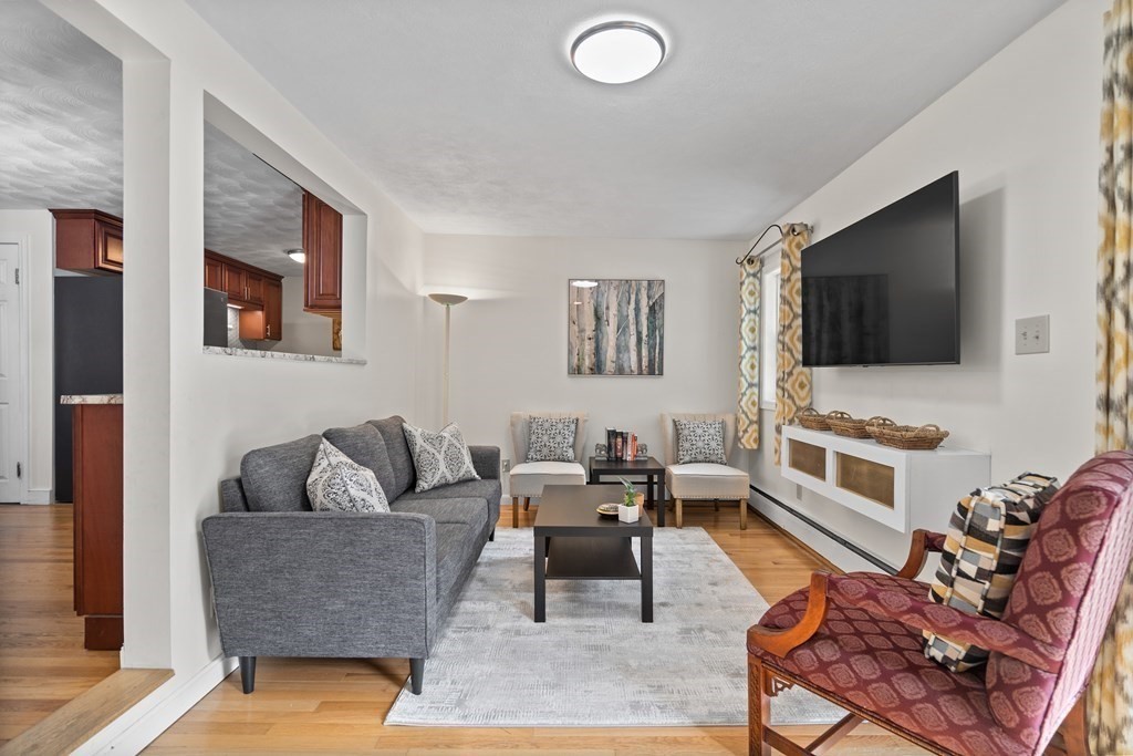 29 Karen Road Wakefield, MA 01880 - Photo 15 of 42 a living room with furniture and a flat screen tv