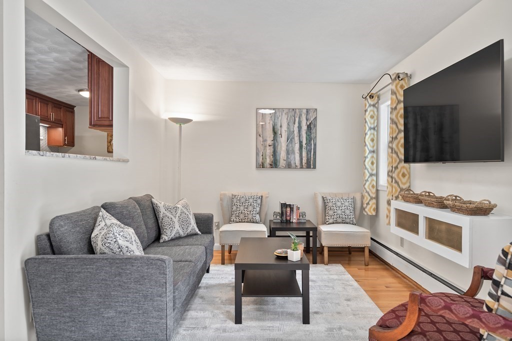 29 Karen Road Wakefield, MA 01880 - Photo 19 of 42 a living room with furniture and a flat screen tv