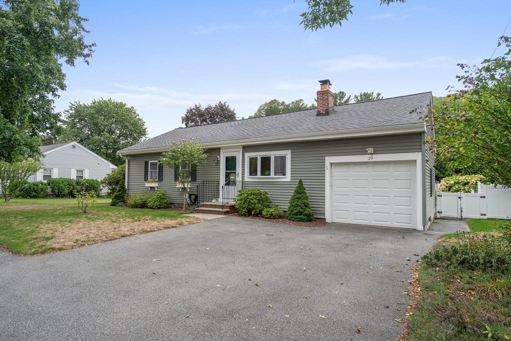 29 Karen Road Wakefield, MA 01880 - Photo 2 of 42 a view of a house with a yard and potted plants