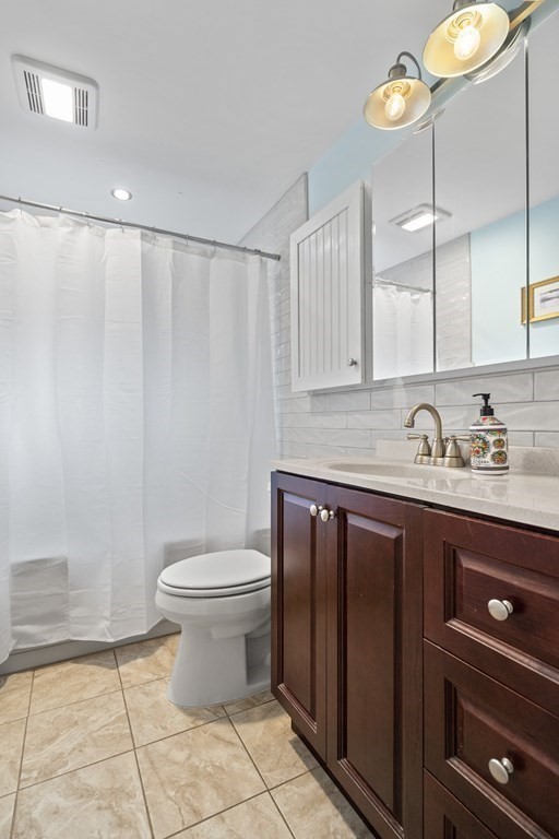 29 Karen Road Wakefield, MA 01880 - Photo 21 of 42 a bathroom with a sink a toilet and a mirror