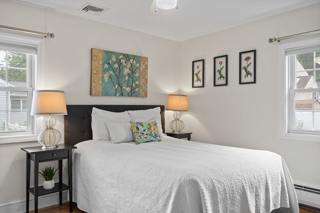 29 Karen Road Wakefield, MA 01880 - Photo 24 of 42 a bedroom with a bed and wooden floor