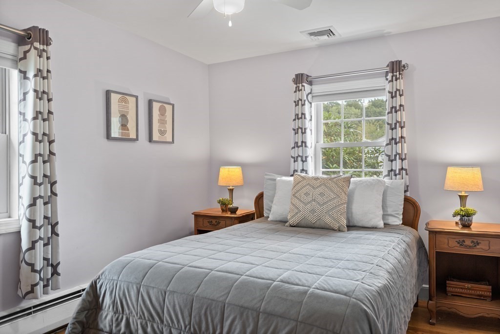 29 Karen Road Wakefield, MA 01880 - Photo 27 of 42 a bedroom with a bed and wooden floor