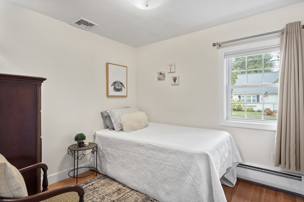 29 Karen Road Wakefield, MA 01880 - Photo 28 of 42 a bedroom with a bed and wooden floor