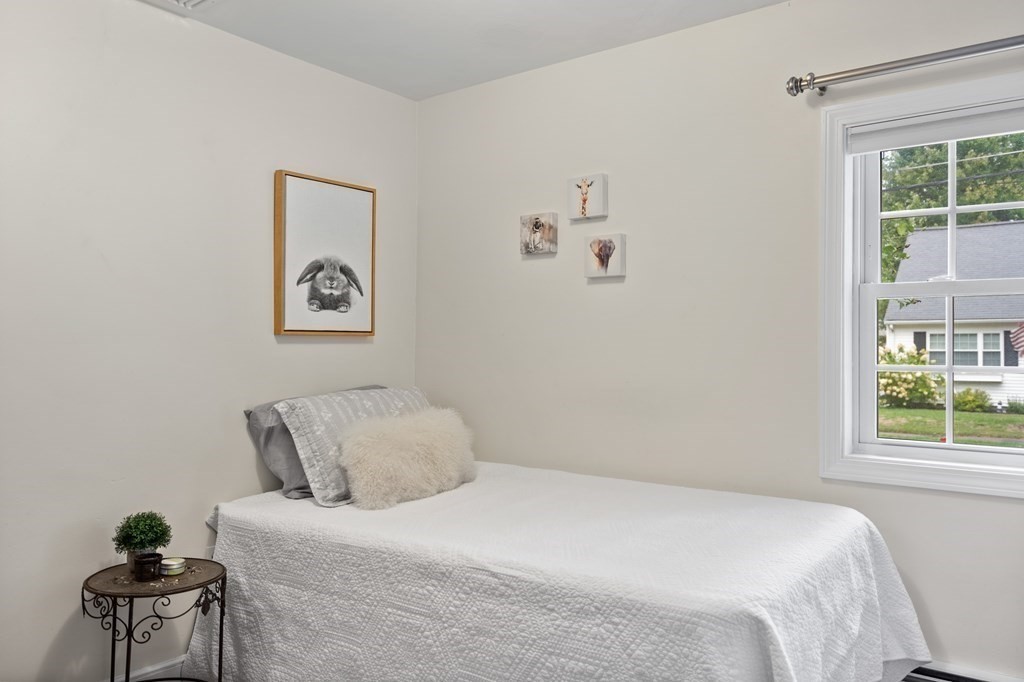 29 Karen Road Wakefield, MA 01880 - Photo 29 of 42 a bedroom with a bed and a window