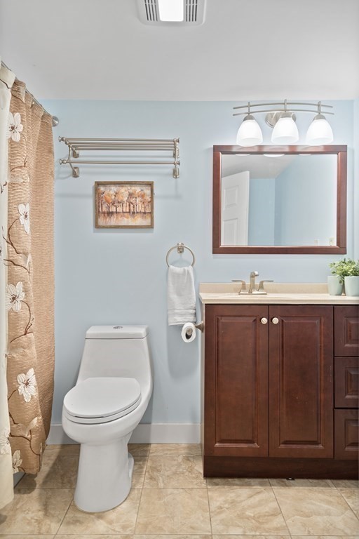 29 Karen Road Wakefield, MA 01880 - Photo 33 of 42 a bathroom with a toilet sink vanity and mirror