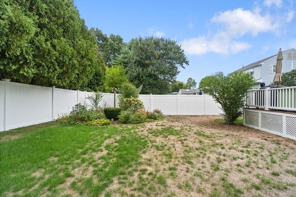 29 Karen Road Wakefield, MA 01880 - Photo 41 of 42 a backyard of a house with lots of green space