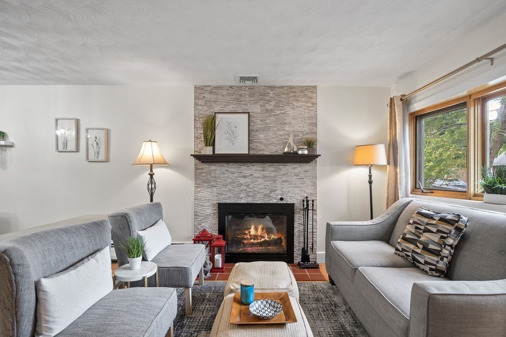 29 Karen Road Wakefield, MA 01880 - Photo 5 of 42 a living room with furniture and a fireplace