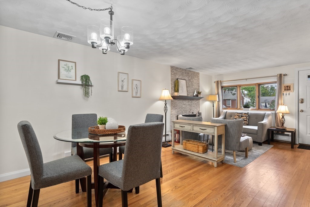 29 Karen Road Wakefield, MA 01880 - Photo 8 of 42 a view of a dining room with furniture a chandelier and wooden floor