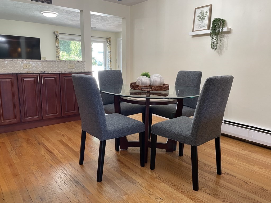 29 Karen Road Wakefield, MA 01880 - Photo 9 of 42 a dining room with furniture and wooden floor