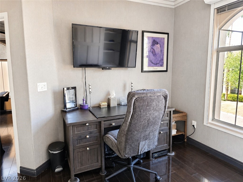 2050 West Warm Springs Road, Unit 2422 Henderson, NV 89014 - Photo 30 of 44 An inviting study with rich wood flooring provides a serene space for productivity and contemplation.