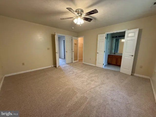 a bathroom with a double vanity sink mirror and shower