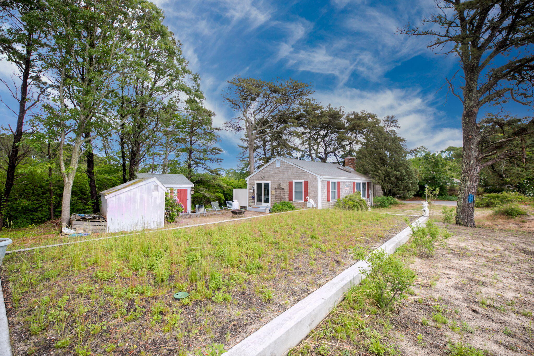 280 Great Pond Road Eastham, MA 02642 - Photo 3 of 54 a front view of a house with garden