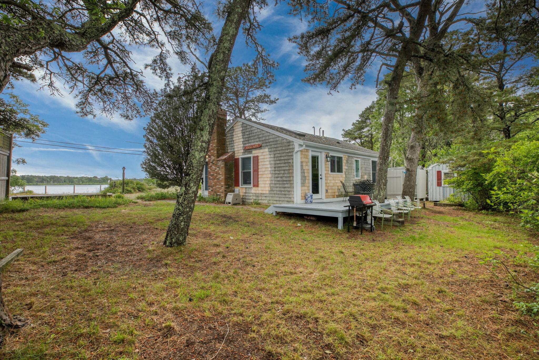 280 Great Pond Road Eastham, MA 02642 - Photo 33 of 54 a view of a house with backyard