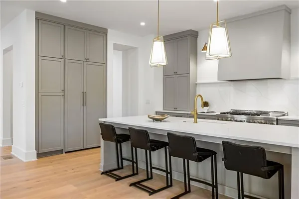 a bed room with a bed and a chandelier