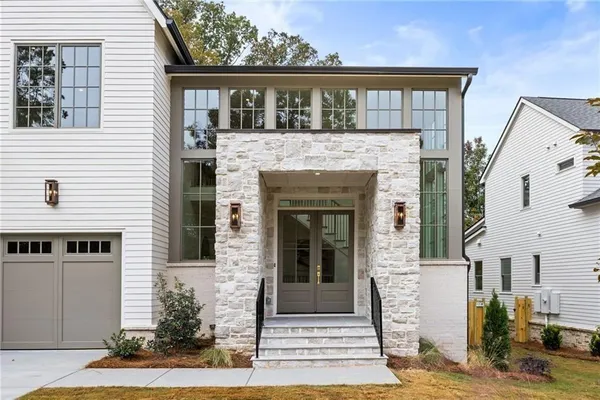 a front view of a house with garden
