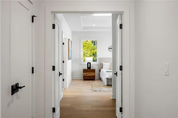 a bathroom with a granite countertop sink toilet and a mirror