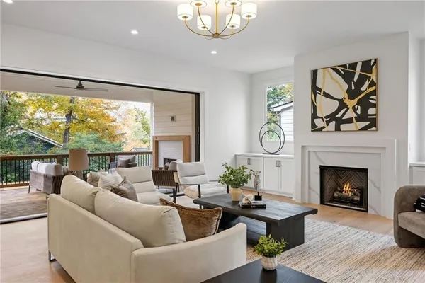 a view of a dining room with furniture and a large window