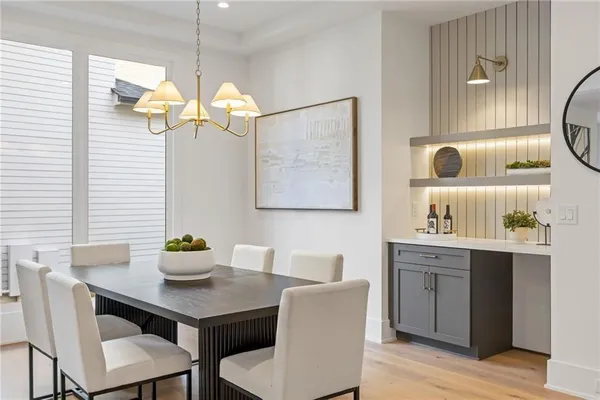 a view of a dining room with furniture and a window