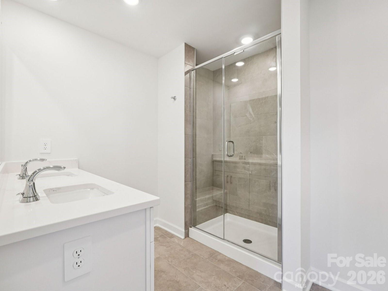 327 Golden Maple Court Fort Mill, SC 29708 - Photo 16 of 18 a bathroom with a shower and sink