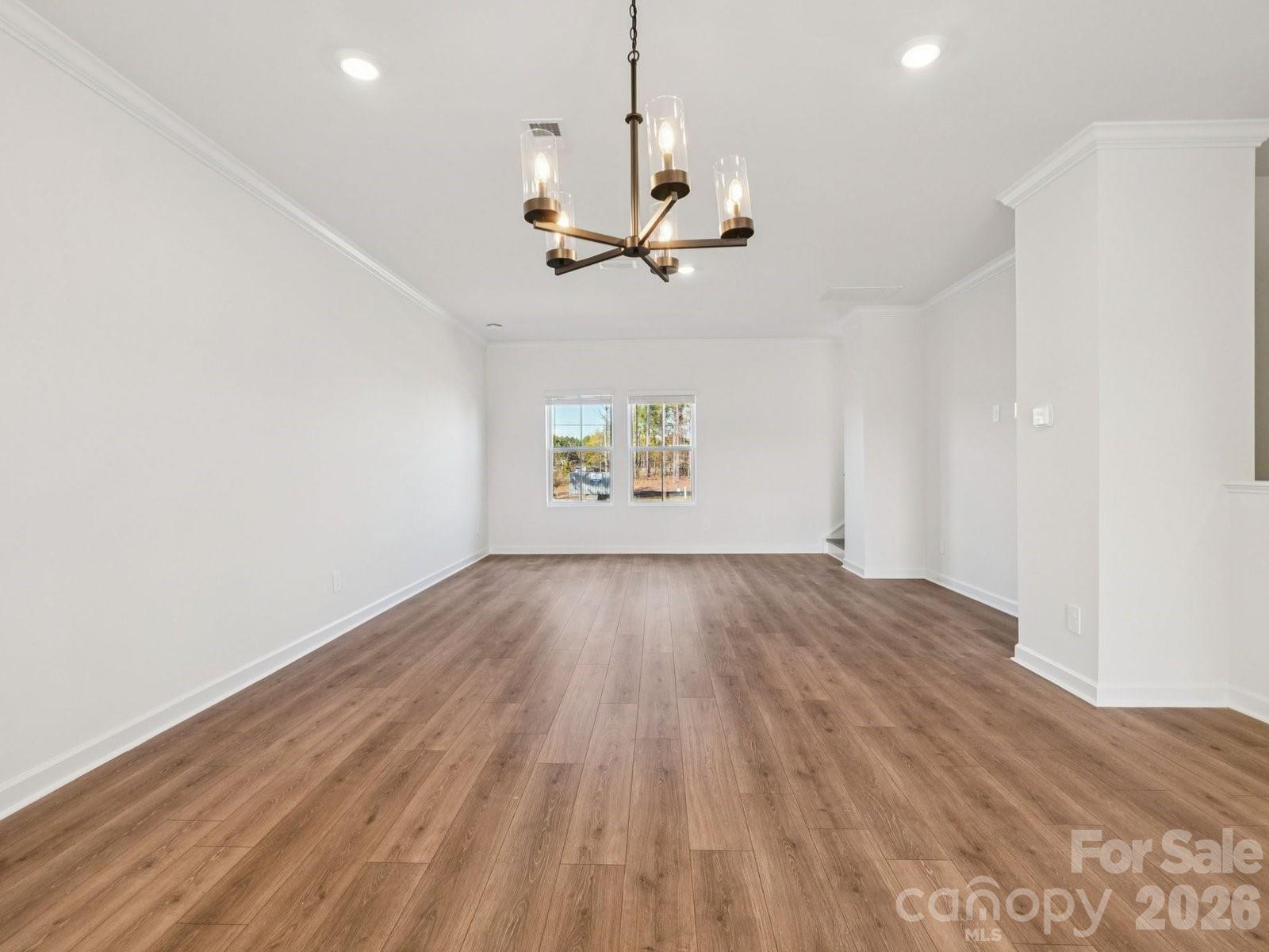 327 Golden Maple Court Fort Mill, SC 29708 - Photo 4 of 18 wooden floor in an empty room with a window