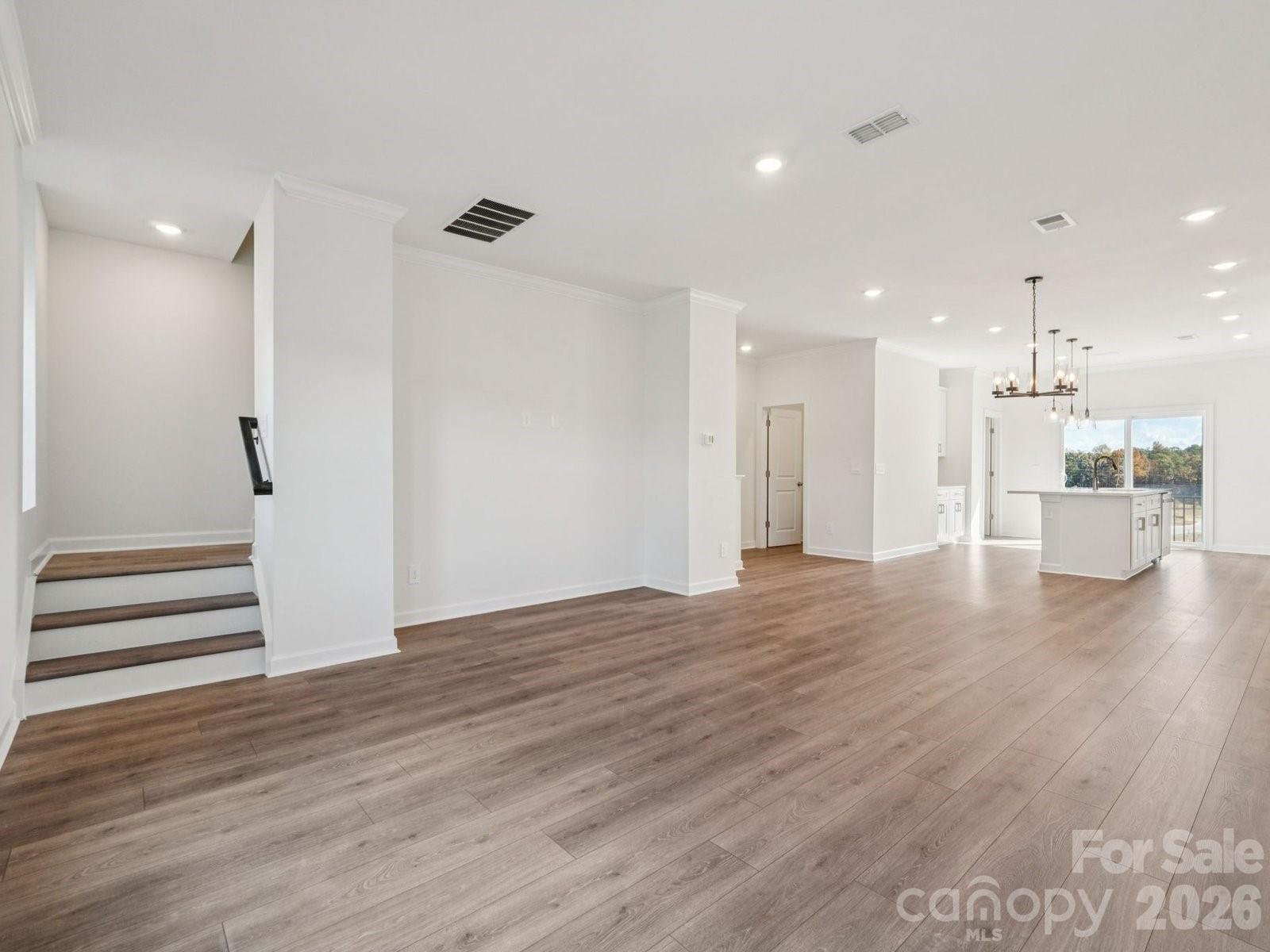 327 Golden Maple Court Fort Mill, SC 29708 - Photo 6 of 18 a view of a kitchen with wooden floor and a window