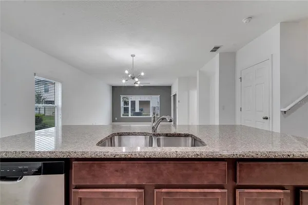 a view of kitchen with furniture and flat screen tv