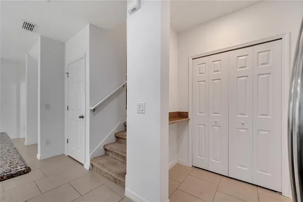 a view of staircase with white walls