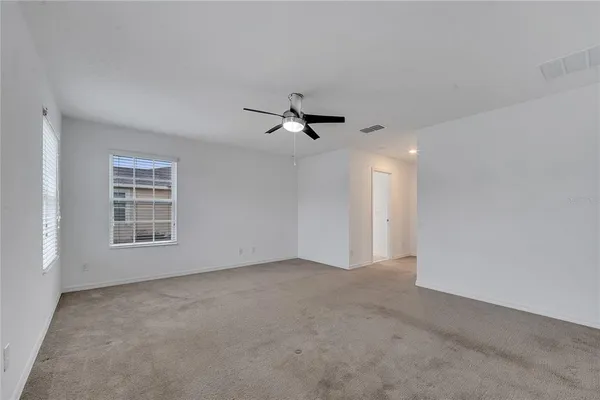 a view of a big room with carpet