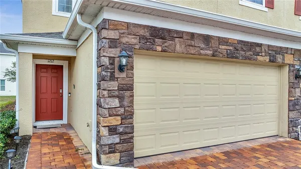 a front view of a house with a outdoor space