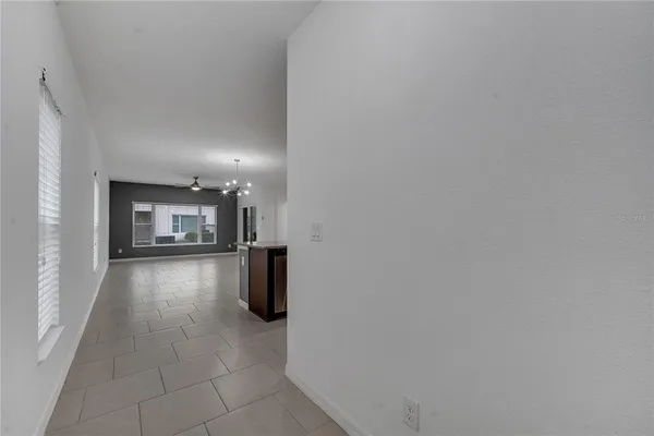 a large kitchen with kitchen island a sink stainless steel appliances and cabinets