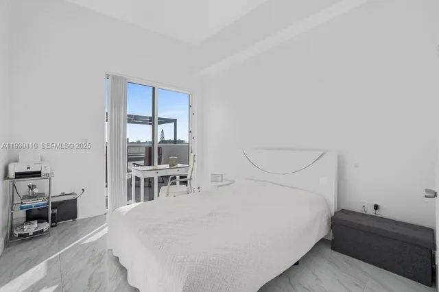 a room with a bed a table and chairs