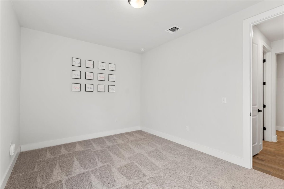 8501 Hillock Terrace Austin, TX 78744 - Photo 15 of 32 wooden floor in an empty room