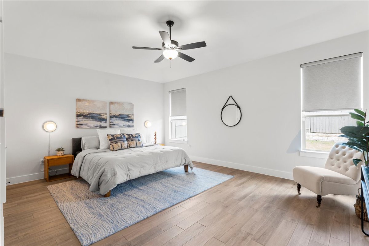 8501 Hillock Terrace Austin, TX 78744 - Photo 18 of 32 a bedroom with a bed and window