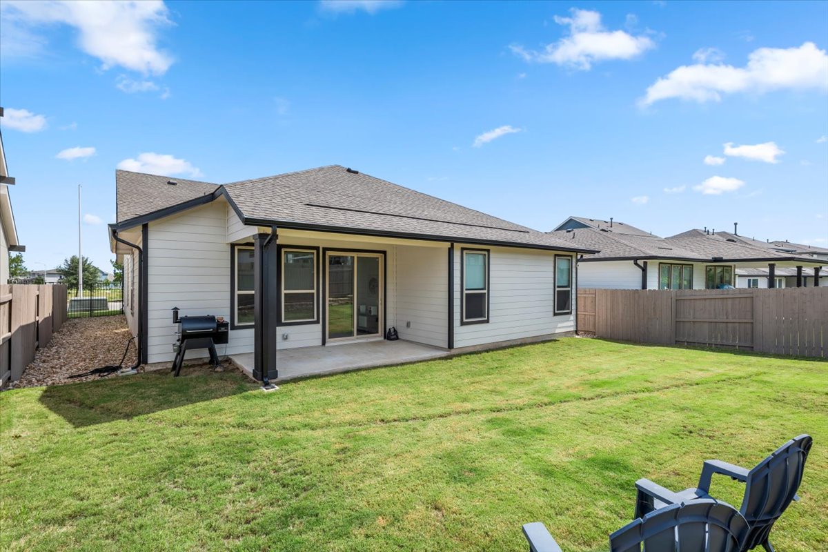 8501 Hillock Terrace Austin, TX 78744 - Photo 30 of 32 a view of a house with a yard and sitting area