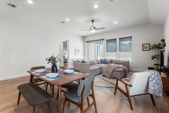 a view of a dining room with furniture and window