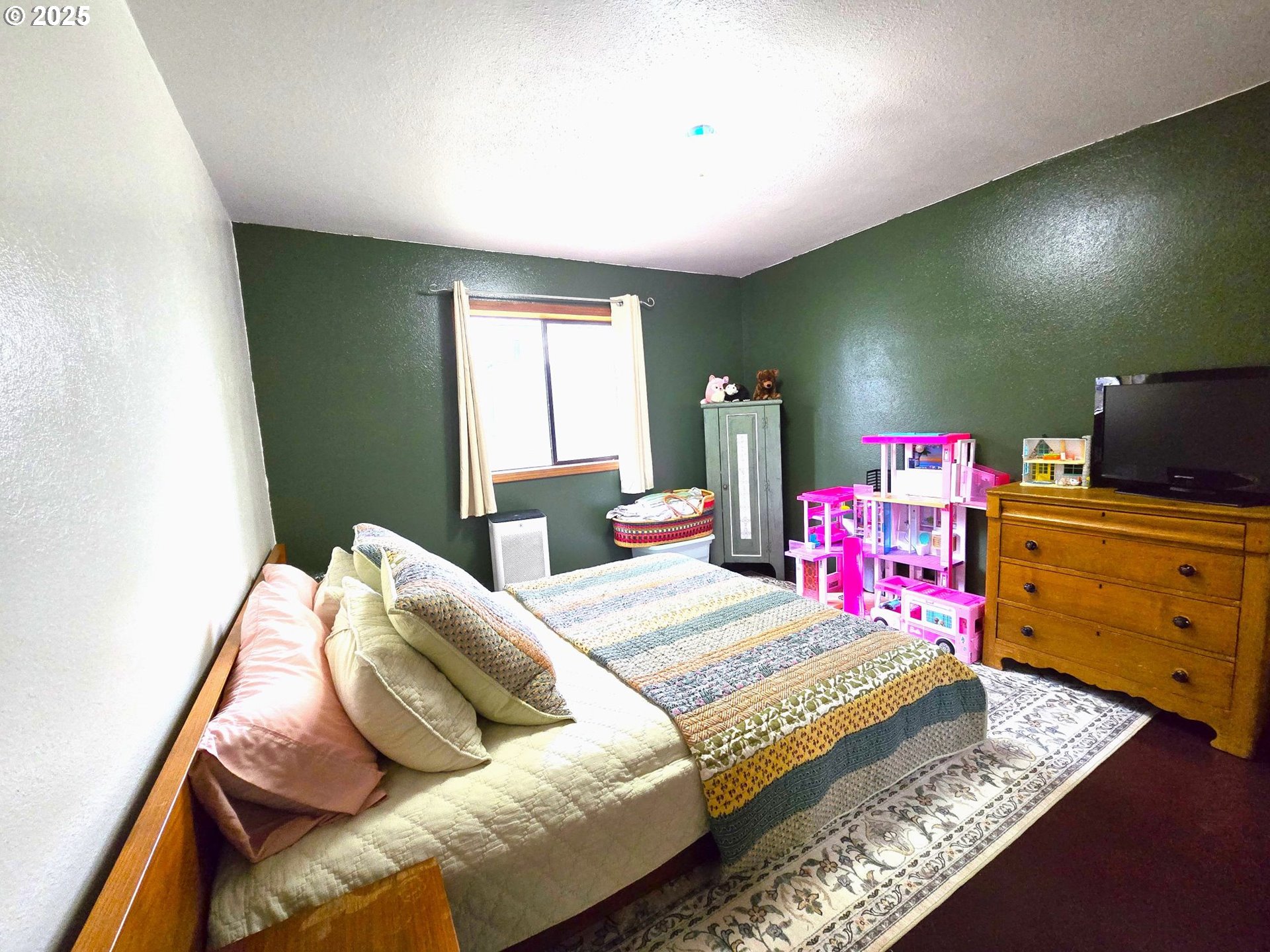 250 2nd Street Long Creek, OR 97856 - Photo 13 of 25 a bedroom with a bed and furniture